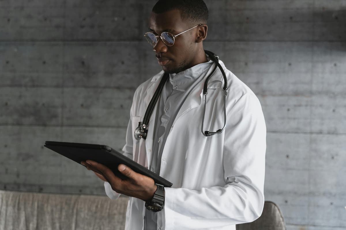 Provider reviewing clinical quality metrics on tablet